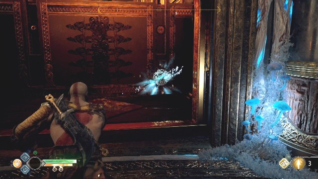 Freeze the set of spikes at the bottom by throwing the axe at the white disc on the set of spikes to break the chains in A Path to Jotenheim in The Journey in God of War.